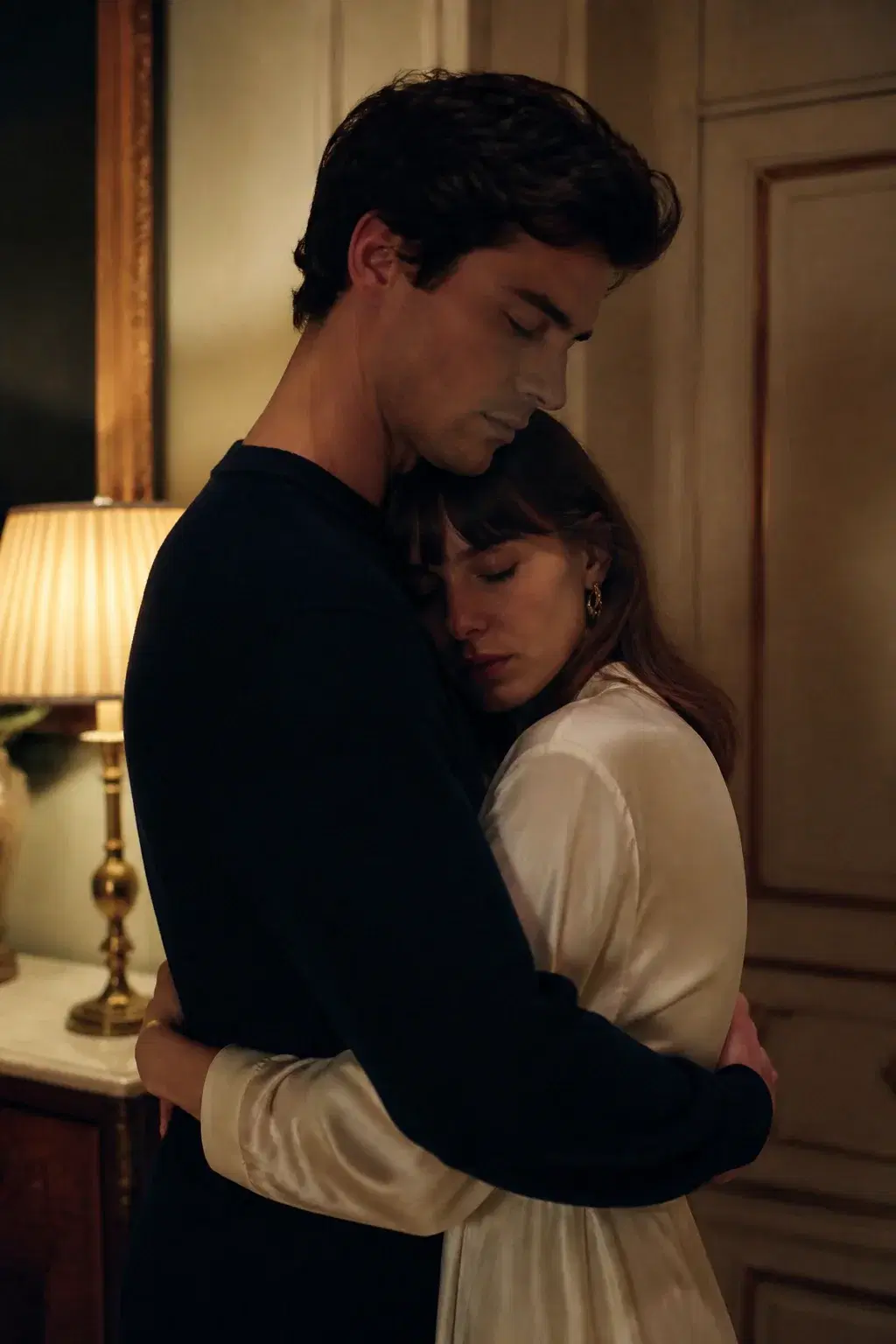 Cinematic portrait of an adult couple in a quiet indoor embrace